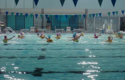 a group of people in a swimming pool