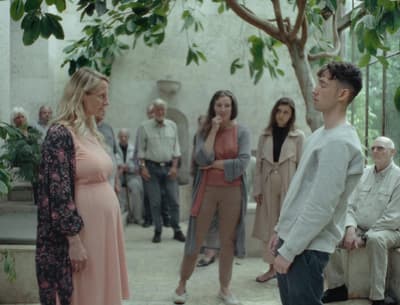a group of people standing around a tree