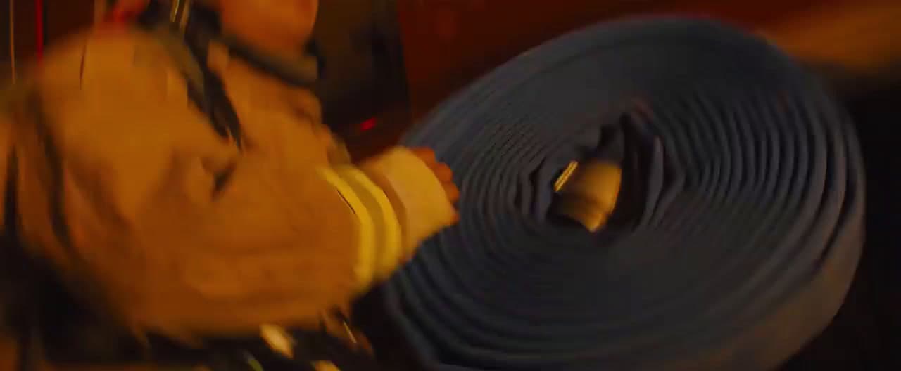 a fireman holding a hose in his hand