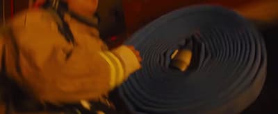 a fireman holding a hose in his hand