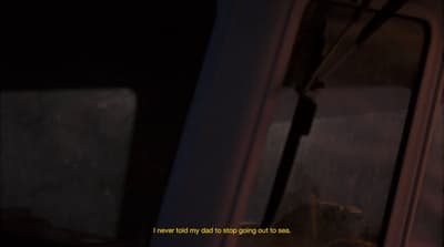 a dog is looking out the window of a train