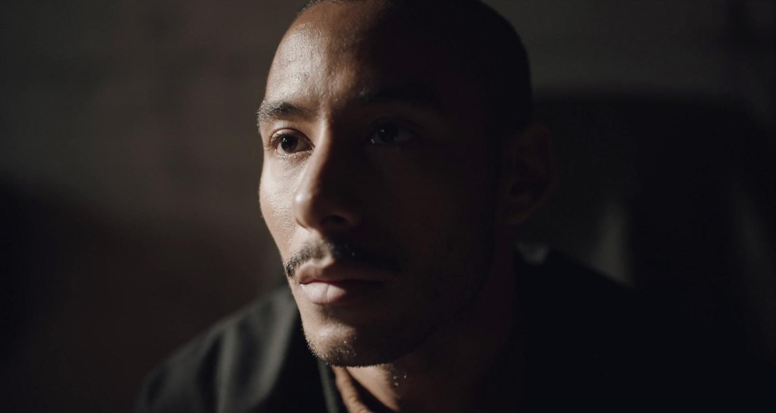a close up of a person wearing a black shirt
