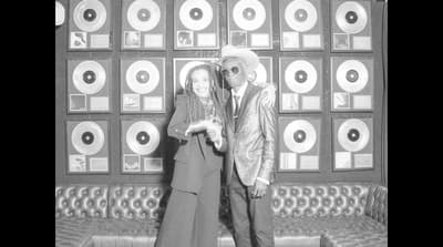 a man and a woman standing next to each other