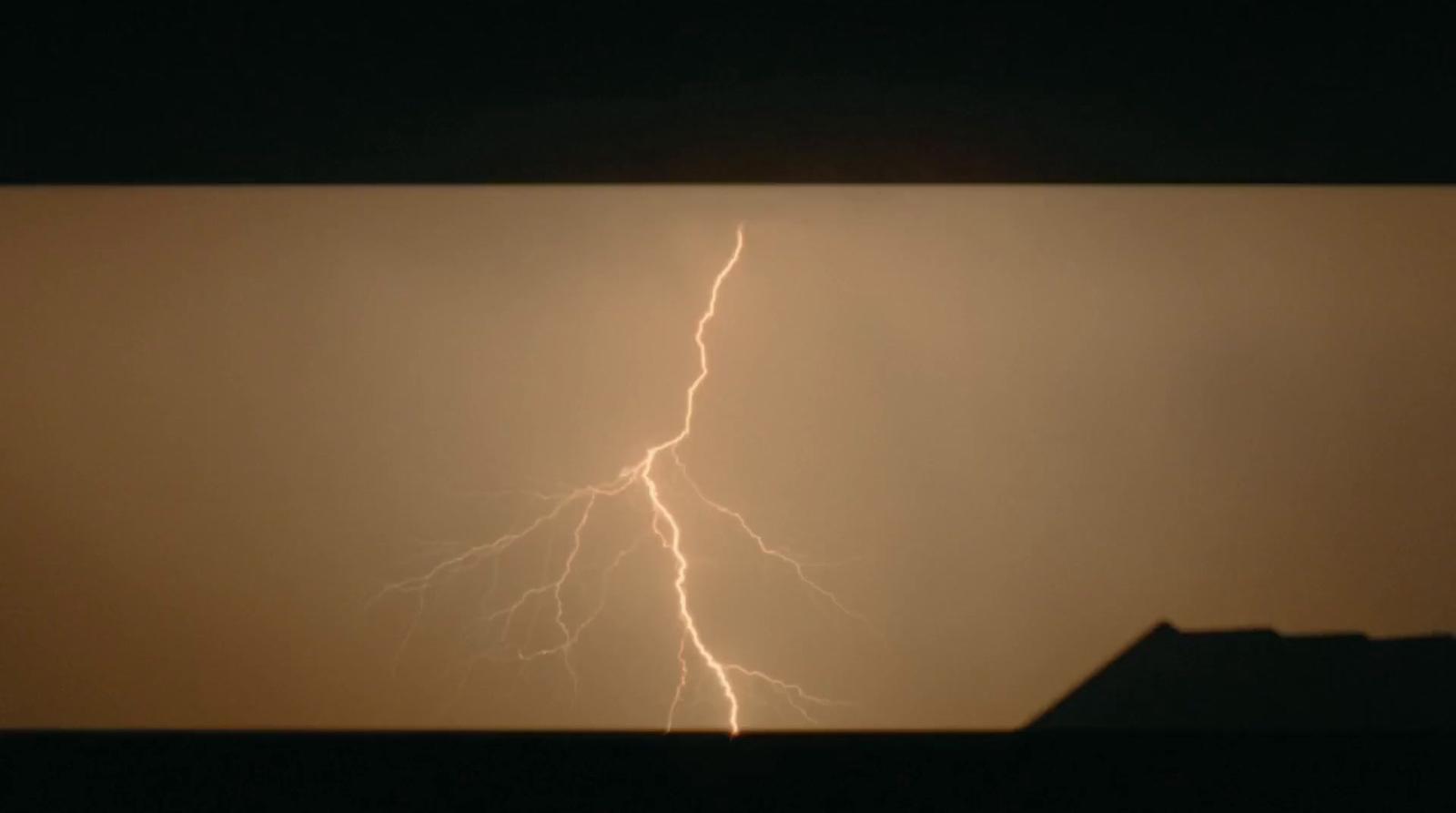 a lightning bolt is seen in the sky