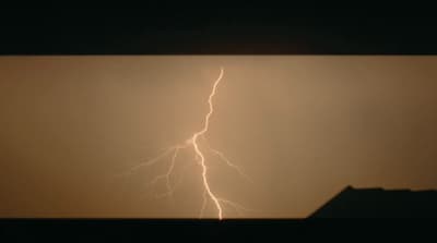 a lightning bolt is seen in the sky