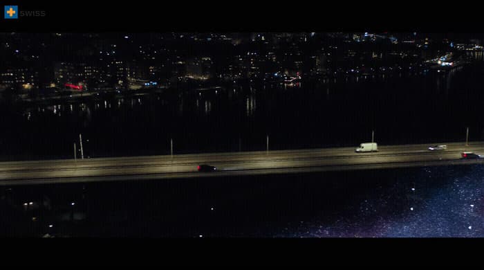 a night time view of a highway and a bridge