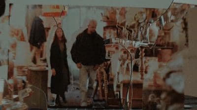 a man and a woman standing in a room