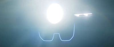 a close up of a pair of glasses on a dark background