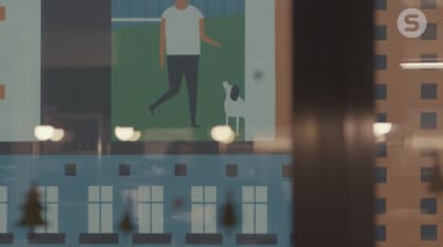 a picture of a man walking a dog through a window