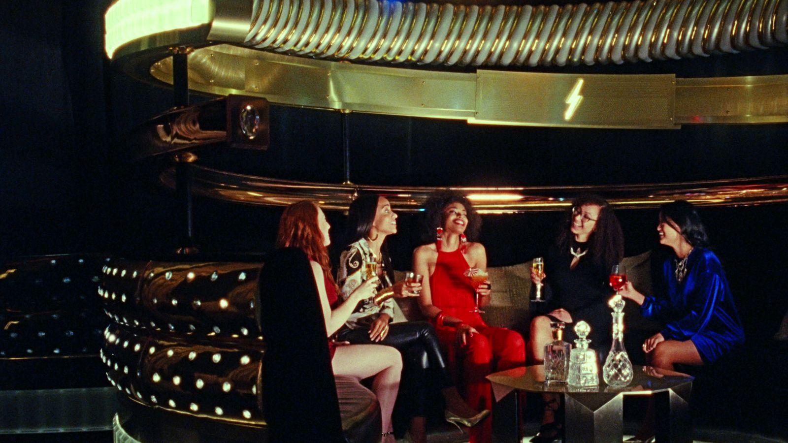 a group of women sitting next to each other