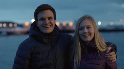 a man and a woman standing next to each other