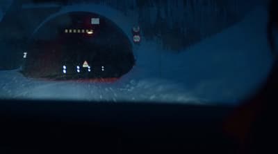 a train traveling through a snow covered forest