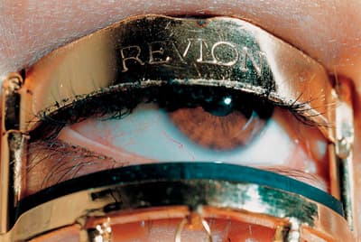 a close up of a person's eye with the word revol written on