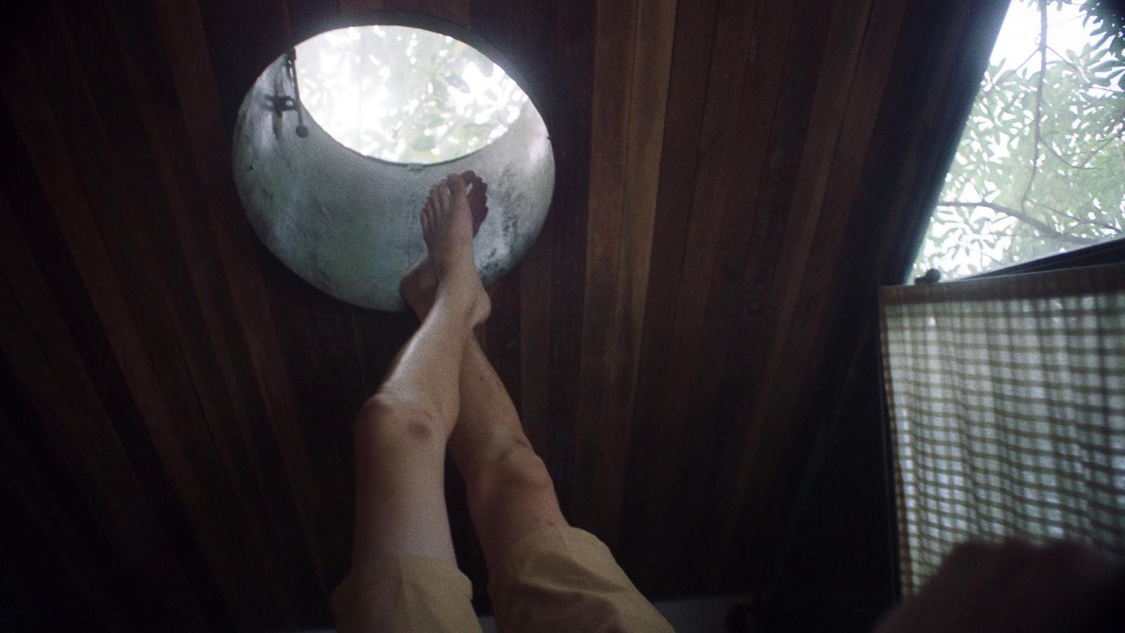 a person standing in front of a round window