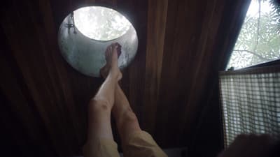 a person standing in front of a round window