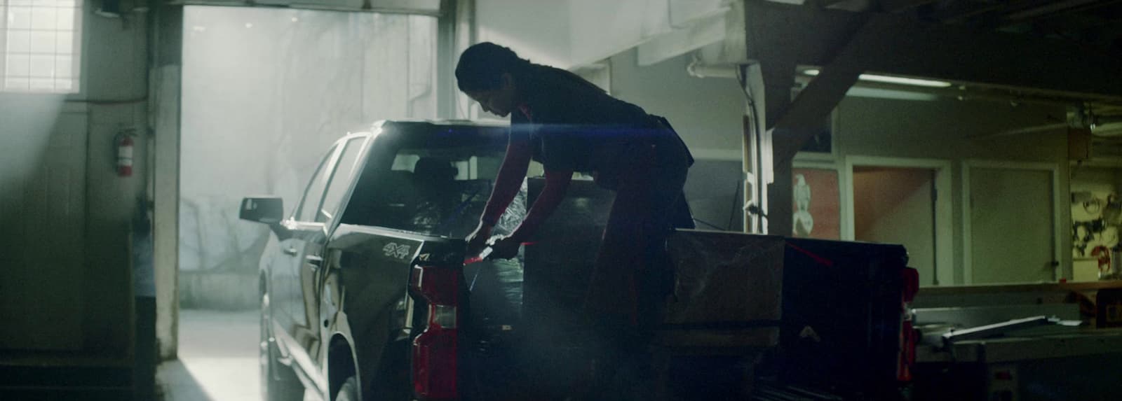 a person standing on the back of a car