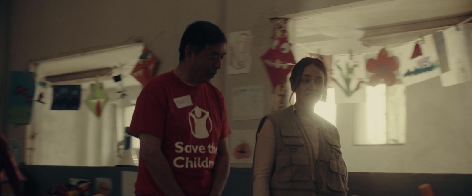 a man and a woman standing in a room