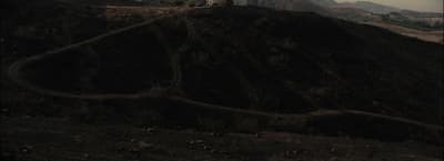 a hill with a clock tower on top of it