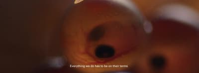 a blurry picture of an apple with a quote on it