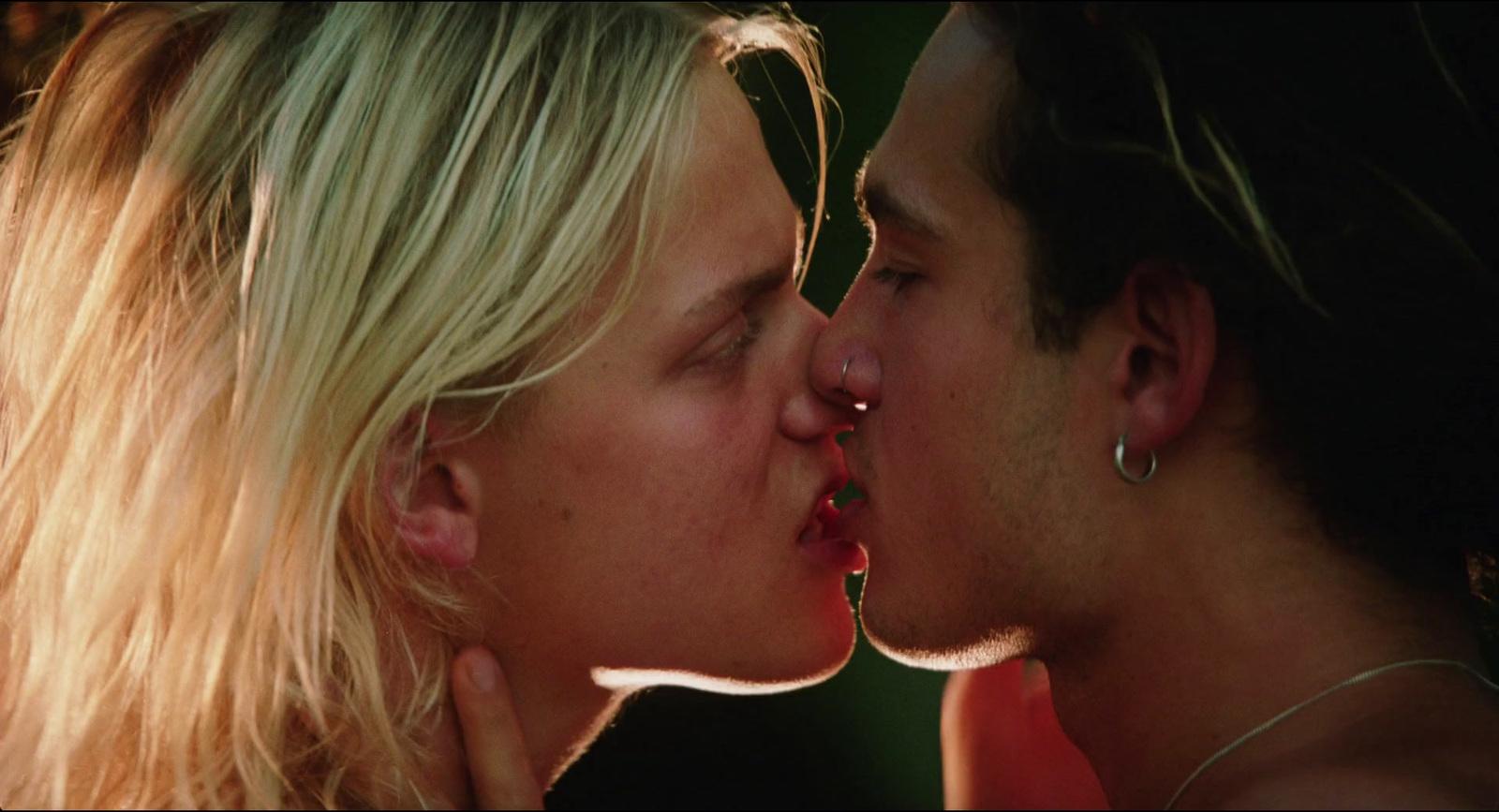 a man and a woman kissing each other