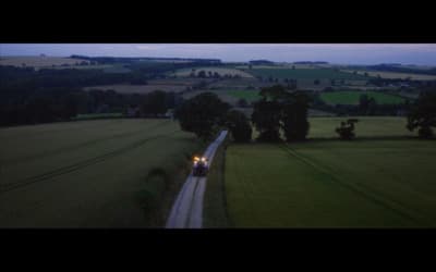 a train traveling through a lush green countryside