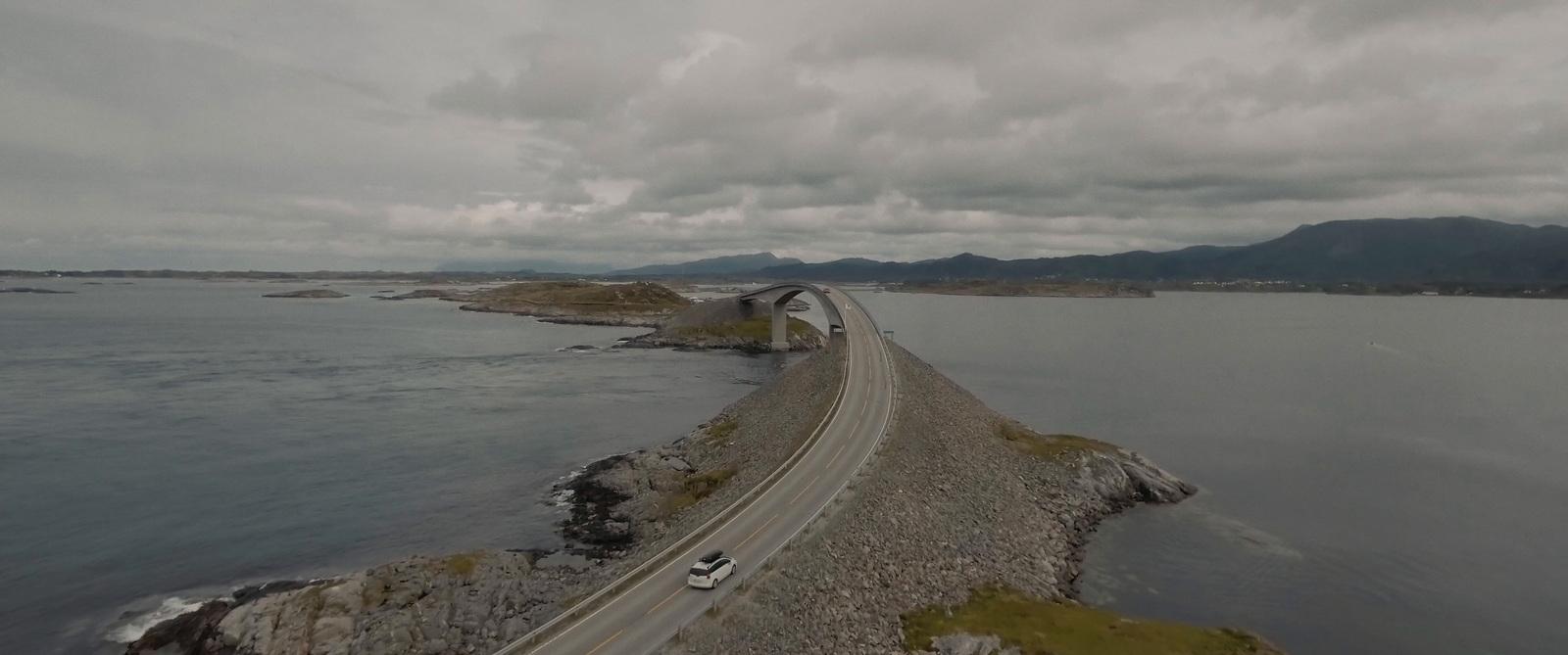 an aerial view of a bridge over a body of water