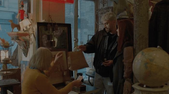 a group of people standing around a room