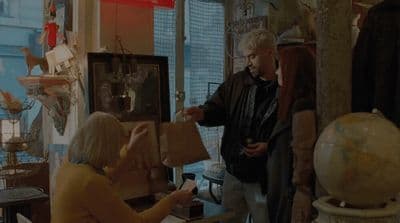 a group of people standing around a room