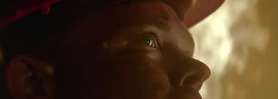 a close up of a person with a hat on