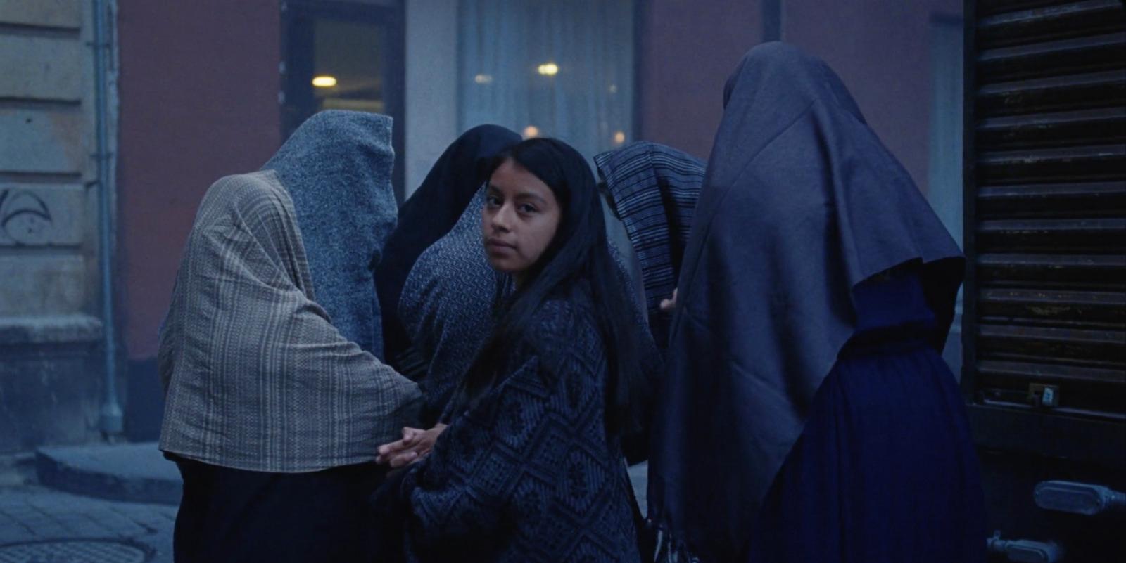 a group of women standing next to each other