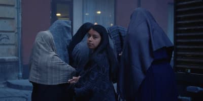 a group of women standing next to each other
