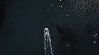 an aerial view of a boat in the water