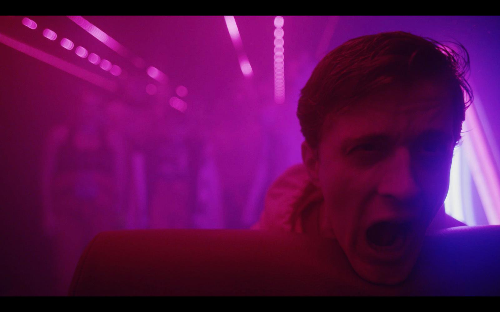 a man with his mouth open standing in a room