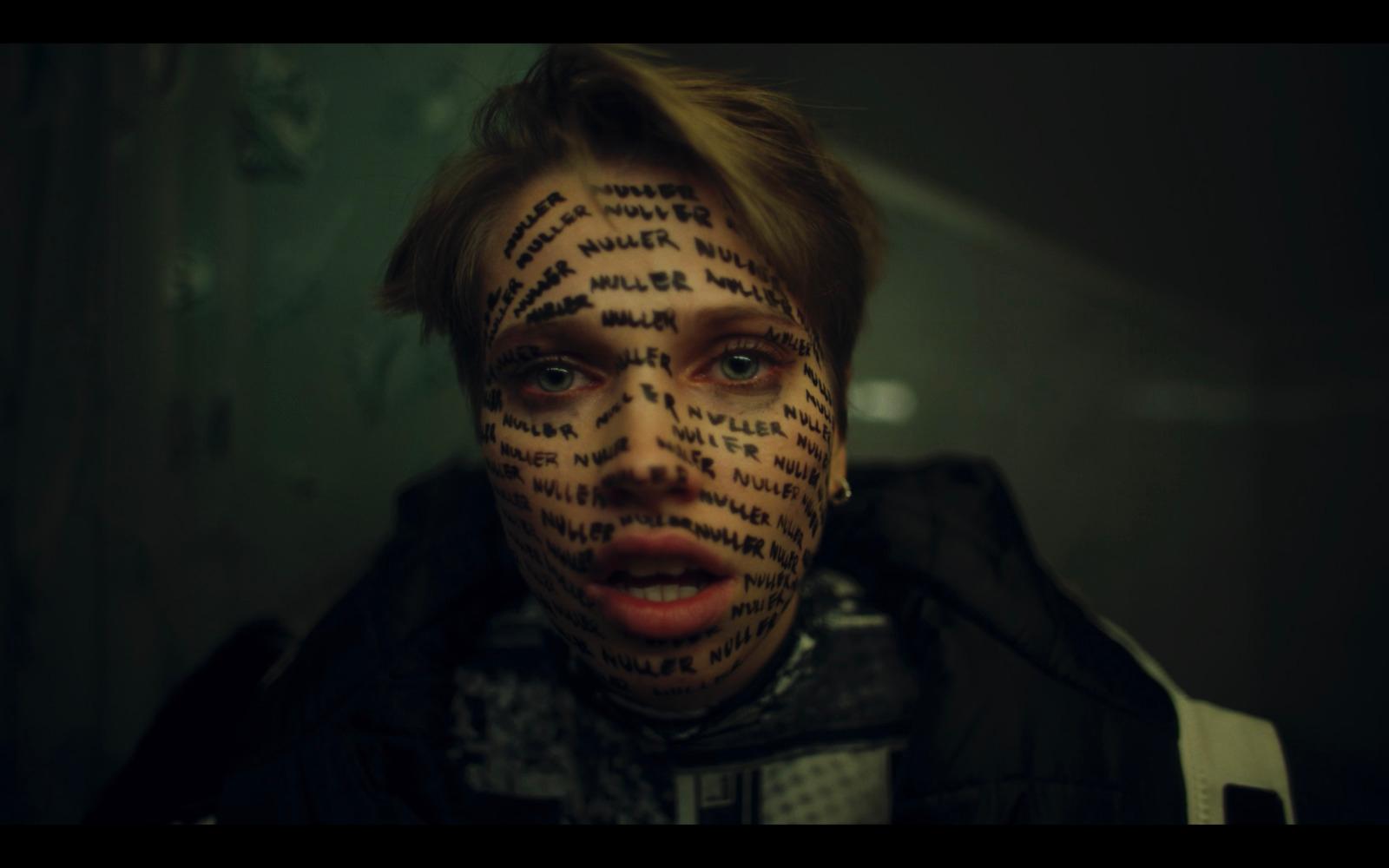 a man with a lot of words on his face