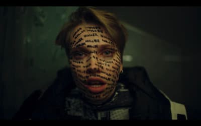 a man with a lot of words on his face