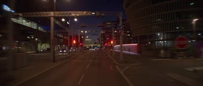 a blurry photo of a city street at night