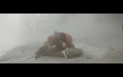 a couple of people that are sitting on the ground