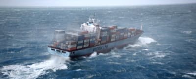 a large cargo ship in the middle of the ocean