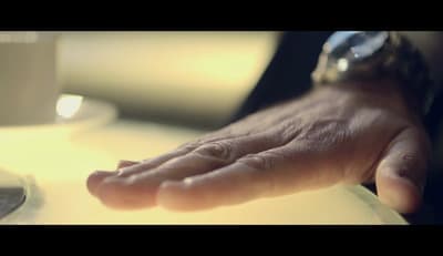 a close up of a person's hand on a table