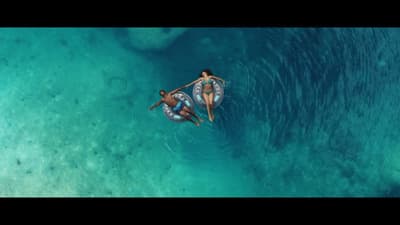 a couple of people riding on the back of a boat