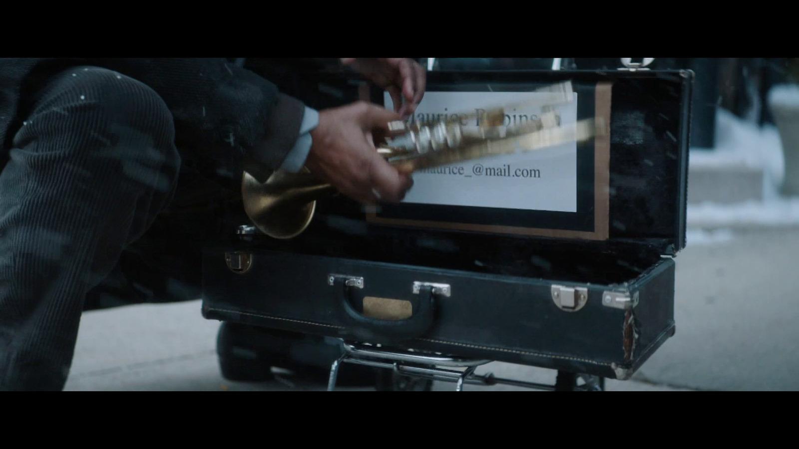 a man is putting something in a suit case