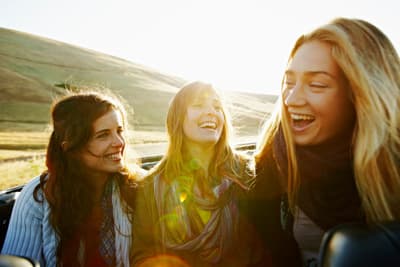 a group of young women standing next to each other