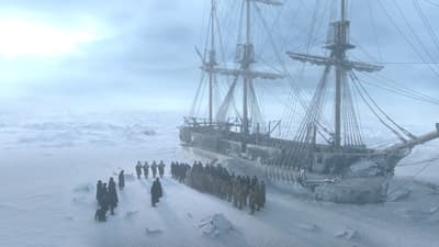 a group of people standing in front of a ship