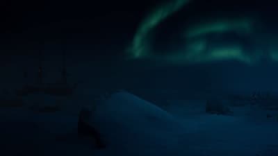 a boat sitting in the snow with the aurora in the background