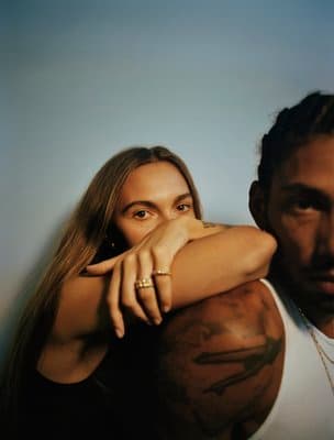 a man and a woman posing for a picture