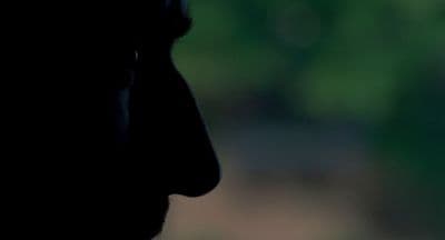 a close up of a person's face with a blurry background