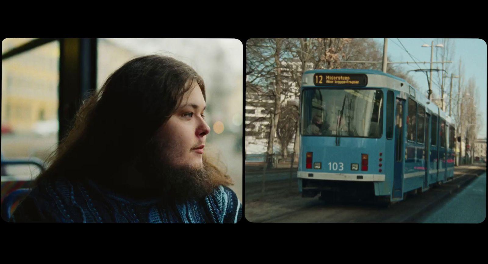 a woman standing in front of a bus on a city street