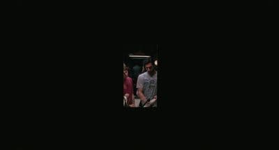 a group of people standing in a dark room