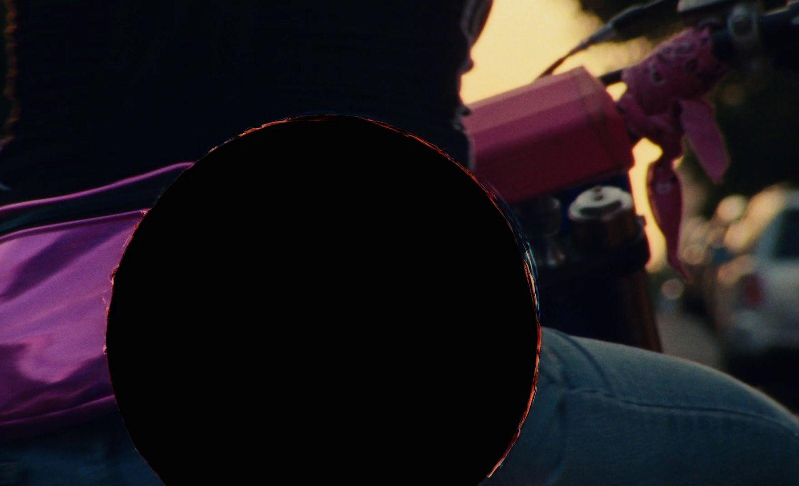 a person with a purple backpack on their back