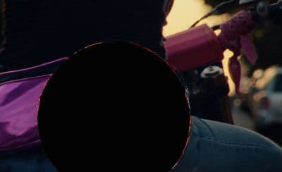 a person with a purple backpack on their back